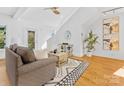 Bright living room with hardwood floors, neutral decor and natural light at 2709 Yadkin Ave, Charlotte, NC 28205