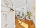 Inviting living room with light hardwood floors and an open floor plan at 2709 Yadkin Ave, Charlotte, NC 28205
