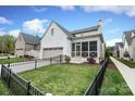 Stylish home featuring a screened porch, fenced yard, and convenient garage at 3119 Knowlton Ln, Charlotte, NC 28205