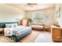 Bright bedroom with wooden furniture, textured rug, and a large window creating a serene and inviting atmosphere at 3905 Farlow Rd, Charlotte, NC 28269
