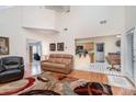 Spacious living room features hardwood floors, a large rug, and access to the kitchen and other rooms at 3905 Farlow Rd, Charlotte, NC 28269