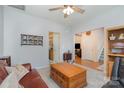 Inviting living room with a cozy couch, ceiling fan, and neutral wall color at 3905 Farlow Rd, Charlotte, NC 28269