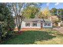 A full view of the home showing its placement on the lot and attractive landscaping at 4515 Country Meadows Dr, Gastonia, NC 28056