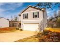 Charming home showcases a two-car garage and low maintenance landscaping at 4852 Stone Dr, Conover, NC 28613