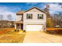 Beautiful two-story home with a well-manicured front yard and attached two-car garage at 4852 Stone Dr, Conover, NC 28613