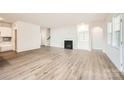 Spacious living room features hardwood floors, fireplace, and built-in shelving at 5926 Oak Branch Cir, Maiden, NC 28650