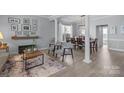 Inviting open-concept space featuring a living area seamlessly connected to a dining space with ample natural light at 1016 Council Fire Cir, Indian Trail, NC 28079