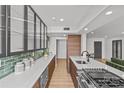 Well-designed kitchen with modern appliances, sleek countertops, and island with sink at 1300 Queens Rd # 408, Charlotte, NC 28207