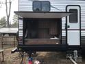 Exterior of an RV with pull-out kitchen area and ample storage at 137 Landlubber Trl, Mount Gilead, NC 27306