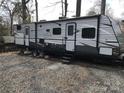 Close up of an RV with entry stairs at 137 Landlubber Trl, Mount Gilead, NC 27306