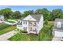 Attractive two-story house with a double porch, neat landscaping, and a cozy, welcoming atmosphere at 2019 Taylorcrest Dr, Fort Mill, SC 29715