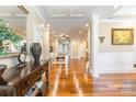 Elegant foyer featuring gleaming hardwood floors, decorative columns, and a view of the living space at 2236 Tuckaway Rd, Rock Hill, SC 29730