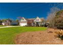Beautiful home featuring a large green lawn and mature trees in a peaceful neighborhood setting at 282 W Shiloh Unity Rd, Lancaster, SC 29720