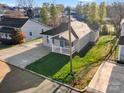 Charming home with a well-manicured lawn, and an inviting front porch, perfect for relaxation and curb appeal at 4 Short St, Belmont, NC 28012