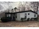 Charming single-story house with a covered front porch and simple landscaping at 6552 Denver Heights Cir, Denver, NC 28037