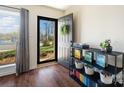 Stylish entryway features dark hardwood floors, a modern console table, and a welcoming open door at 7656 Eastbourne Rd, Charlotte, NC 28227