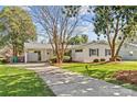 Charming home featuring a long driveway, carport, and a well-maintained lawn at 821 Fairbanks Rd, Charlotte, NC 28210