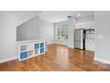 Bright, open living area with hardwood floors and stainless steel appliances at 840 Garden District Dr, Charlotte, NC 28202