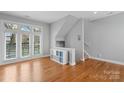 Bright, open living area with hardwood floors and large windows at 840 Garden District Dr, Charlotte, NC 28202
