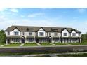 New construction townhomes featuring brick facade, black accents, and professionally landscaped front yards at 8642 Miles Gap Rd, Indian Land, SC 29707