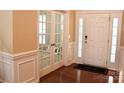 Elegant foyer with hardwood floors and paneled walls at 13127 Centennial Commons Pkwy, Huntersville, NC 28078