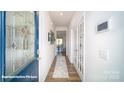 Bright entryway with wood flooring and stylish decor leading to the dining area at 133 Calvin Creek Dr, Troutman, NC 28166