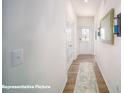 Bright hallway with hard wood floors, mirror on wall, and light switch visible in photo at 133 Calvin Creek Dr, Troutman, NC 28166