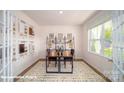 Well-lit office space with a desk, large window, and French doors at 133 Calvin Creek Dr, Troutman, NC 28166