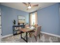 Bright, carpeted home office featuring a ceiling fan, desk, and a window for natural light at 2011 Mantle Ridge Dr # 193, Wesley Chapel, NC 28079