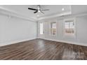 Spacious primary bedroom featuring tray ceiling, wood-look flooring, and ample natural light at 2078 Fordhill St, Rock Hill, SC 29732