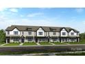 A row of attractive townhomes features painted white brick, black trim, and matching black front doors at 8654 Miles Gap Rd, Indian Land, SC 29707