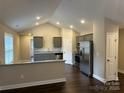 Modern kitchen with stainless steel appliances, gray cabinets, and granite countertops at 39 Solomon St, Wadesboro, NC 28170