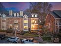 Attractive brick home with manicured landscaping, a private balcony, and well-maintained lawn at 415 Spring St, Davidson, NC 28036