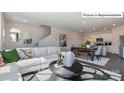 Open-concept living space with a comfortable seating area, dining table, and a modern kitchen at 2048 Harlequin Dr, Indian Trail, NC 28079