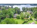 Picturesque aerial view of a home surrounded by lush trees near the water at 3004 Vernell Ln, Shelby, NC 28150