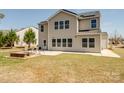 Spacious backyard featuring a patio area with outdoor seating, perfect for entertaining and relaxation at 8137 Bryson Rd, Fort Mill, SC 29707