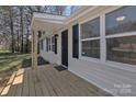 Close up of the home's entry way and front porch, completed with fresh, natural-tone wood at 1034 Marietta St, Charlotte, NC 28214