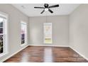 Cozy bedroom features neutral walls, laminate flooring, and natural light at 119 Tilton Dr, Mooresville, NC 28115