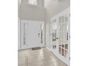 Bright foyer with tile flooring and transom windows with a beautiful front door at 119 Tilton Dr, Mooresville, NC 28115