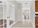 Inviting hallway features tiled floors and elegant French doors leading to other spaces at 119 Tilton Dr, Mooresville, NC 28115
