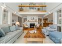 Bright living room with a fireplace, wooden accents, soaring ceilings, and plenty of natural light at 121 Rhinehill Dr, Mooresville, NC 28117