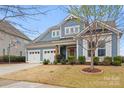 Charming two-story home with a two-car garage, landscaped yard, and inviting curb appeal at 12619 Old Westbury Dr, Cornelius, NC 28031