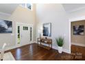 Bright foyer boasts hardwood floors, high ceilings, and natural light from a glass paneled front door at 1300 Aragon Beach Rd, Rock Hill, SC 29732