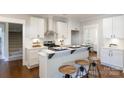 Bright kitchen with white cabinetry, stainless steel appliances, and breakfast bar with seating at 1300 Aragon Beach Rd, Rock Hill, SC 29732