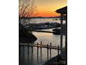Sunset view of marina and pier, the sky with vibrant colors reflecting on calm water at 18009 Kings Point Dr # C, Cornelius, NC 28031