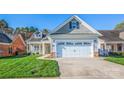 Charming home with a well-maintained lawn and an attached two-car garage at 229 River Birch Dr, Salisbury, NC 28146
