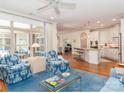 Bright living room with hardwood floors, a large window, and views of the kitchen at 2342 Wesley Landing Rd, Waxhaw, NC 28173