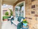 Inviting front porch with comfortable seating, perfect for enjoying the outdoors at 2342 Wesley Landing Rd, Waxhaw, NC 28173