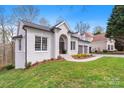 Charming brick home featuring a two-car garage and a well-manicured front yard at 4012 Cambridge Hill Ln, Charlotte, NC 28270