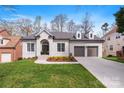 Charming brick home featuring a two-car garage and a well-manicured front yard at 4012 Cambridge Hill Ln, Charlotte, NC 28270